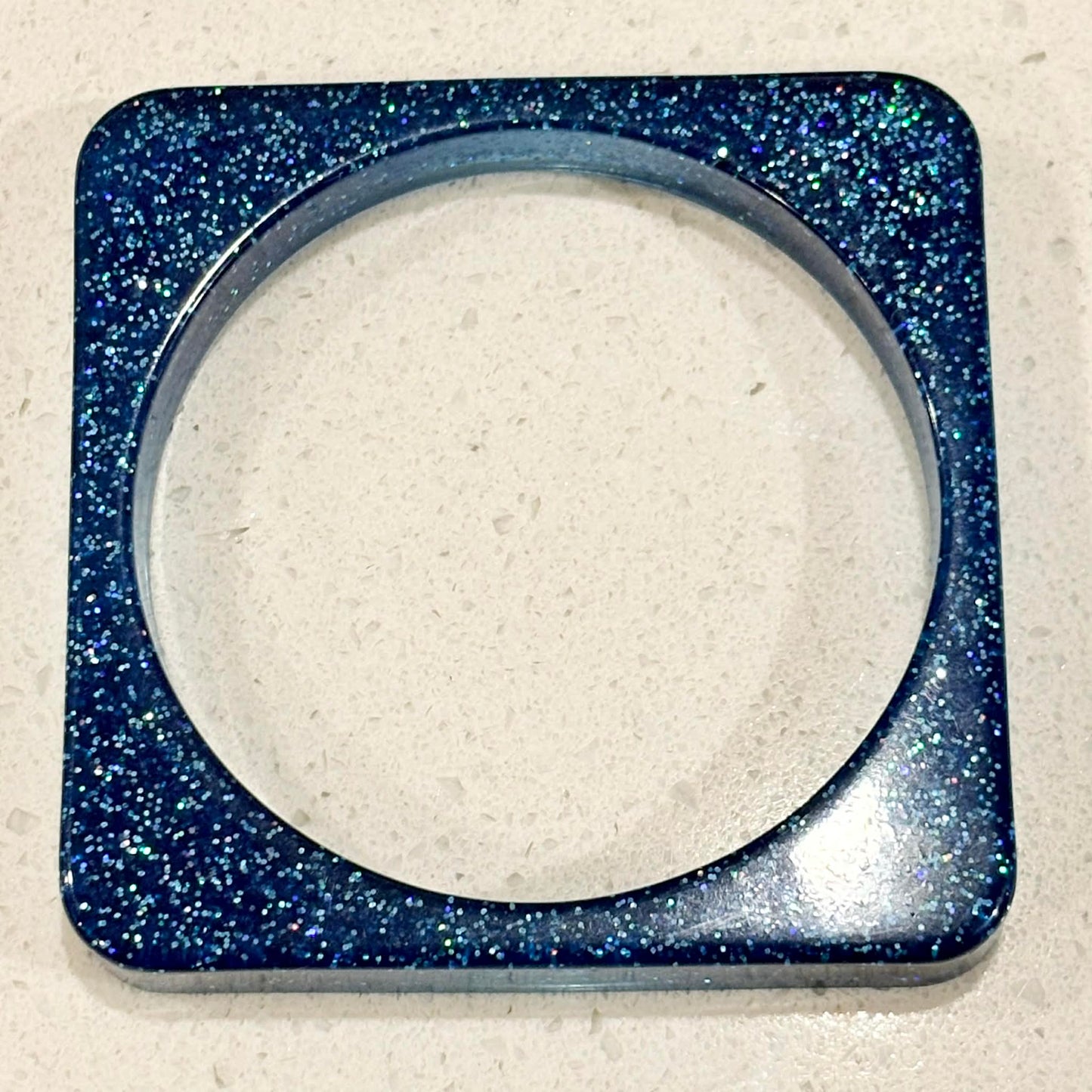 RAY BY DESIGN - Resin Bangle Blue Glitter Square