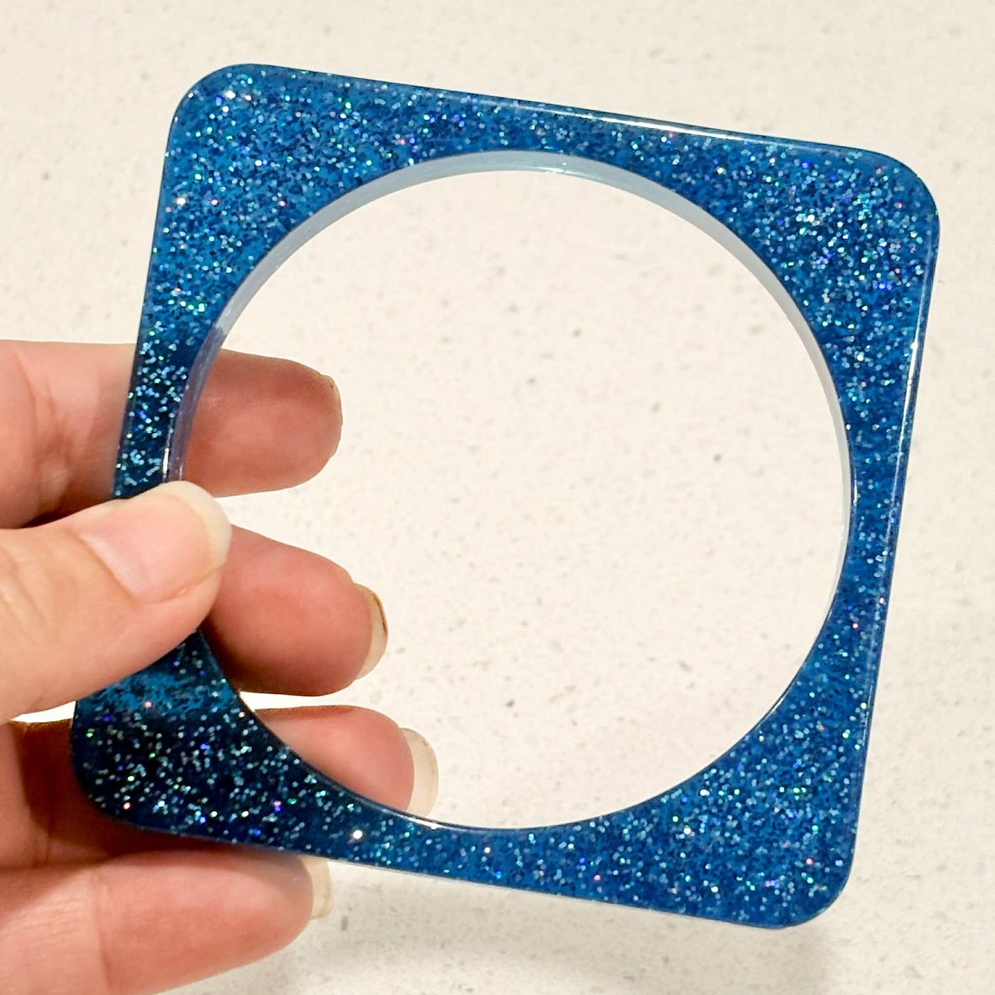 RAY BY DESIGN - Resin Bangle Blue Glitter Square
